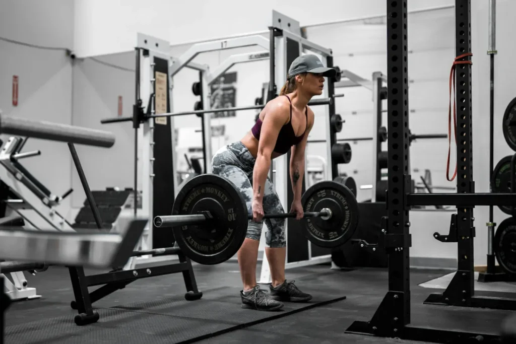 Woman strength training in a gym